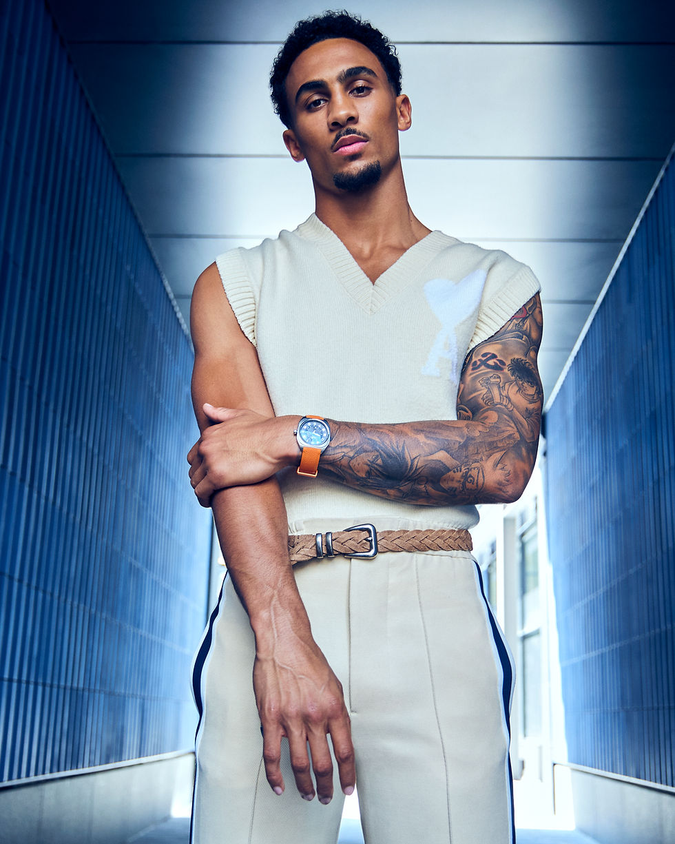 Ben Whittaker in a cream knit vest