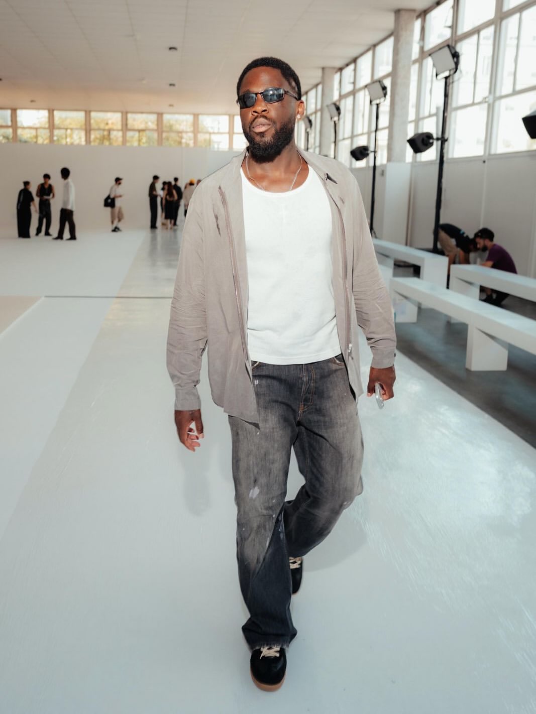Orel Mangala wearing sunglasses at a fashion event
